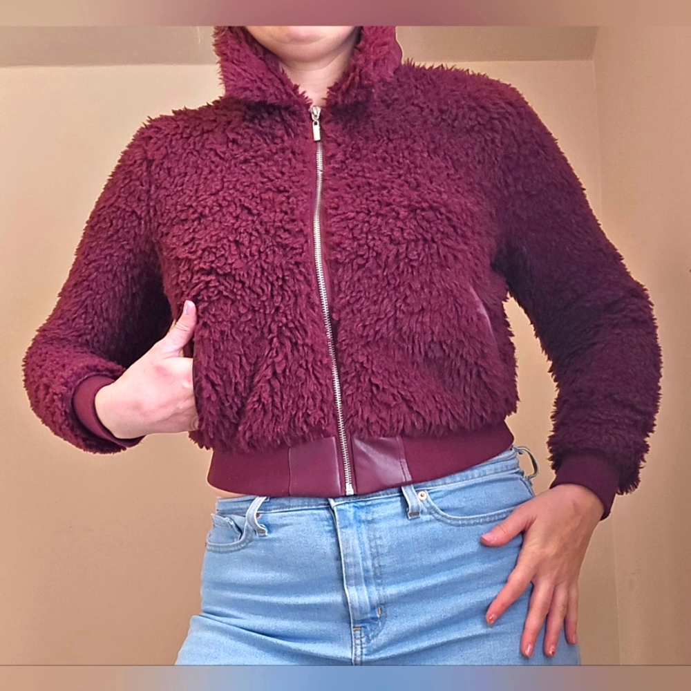 GUESS Faux Fur bomber jacket. Zip up. Fully lined. Size Small. Eggplant/ Purple.